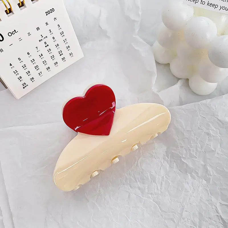 Ivory claw clip with red heart detail