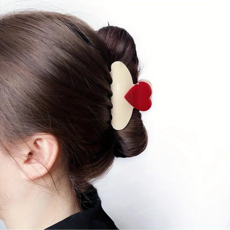 Ivory claw clip with red heart detail