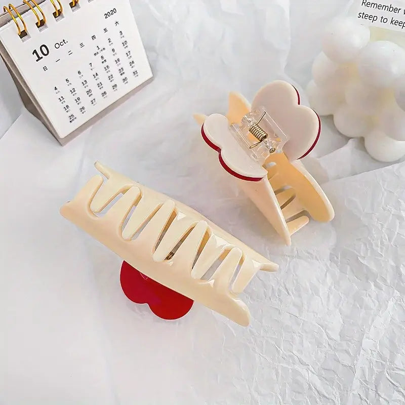 Ivory claw clip with red heart detail