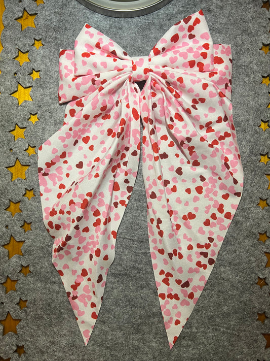 Large white bow with hearts