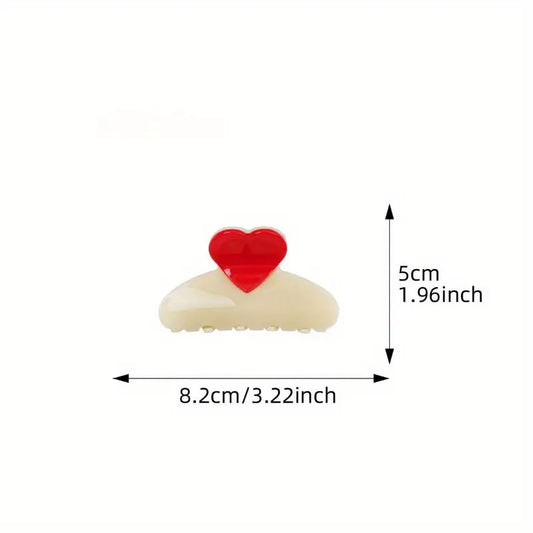 Ivory claw clip with red heart detail