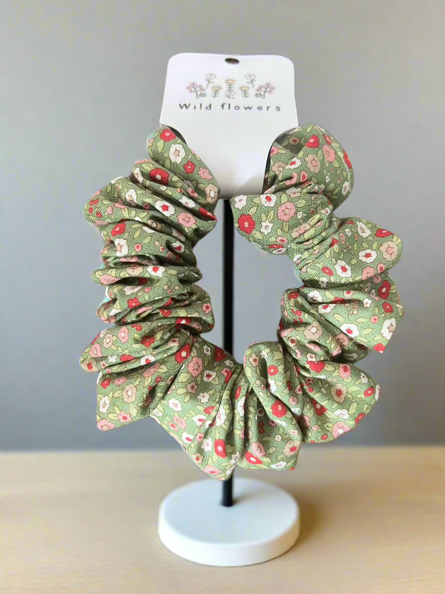 Green scrunchie with red white and pink flowers