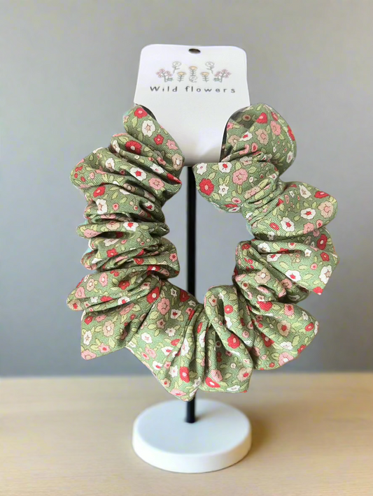Green scrunchie with red white and pink flowers
